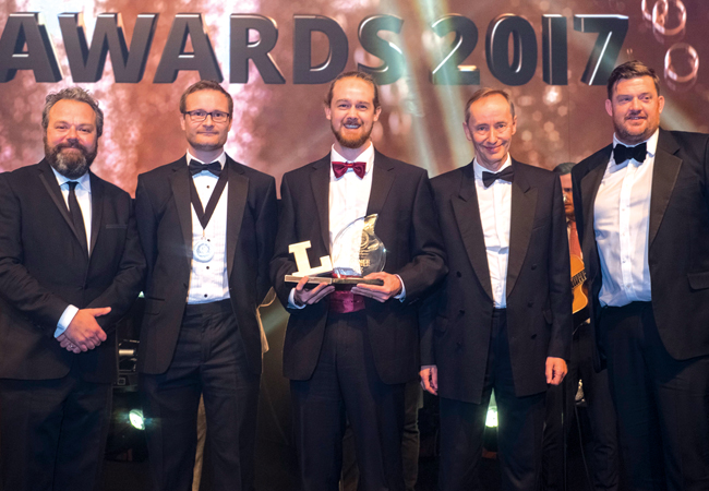 From left: Comedian and Lux Awards host Hal Cruttenden; SLL president Richard Caple; Young Lighter Matt Hanbury; and Mark Sutton Vane, judging on behalf of the LET